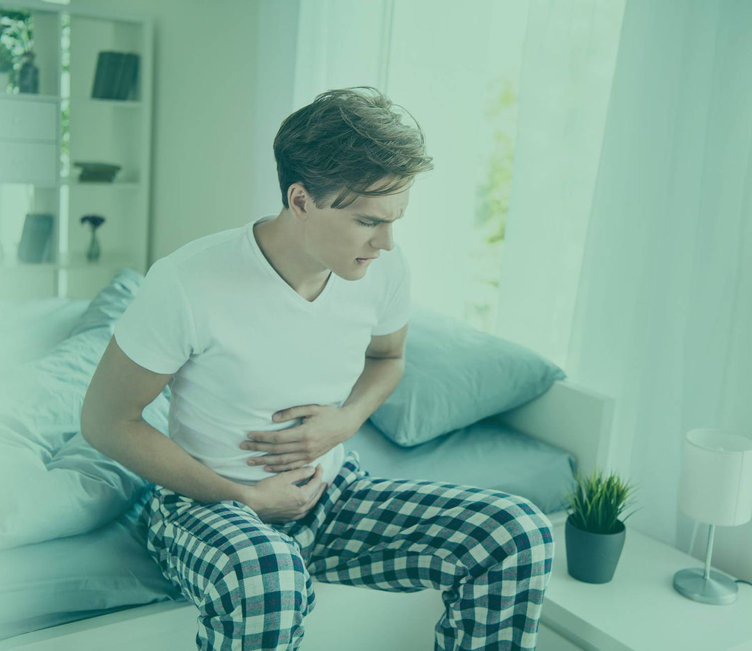 man suffering from gut pain