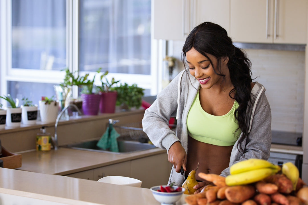 woman cutting up fruit